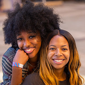 Two female students pose for portrait during a Homecoming Carnival at the Student Union Plaza on October 28, 2019. Photo by Steven Bridges/University of Tennessee 