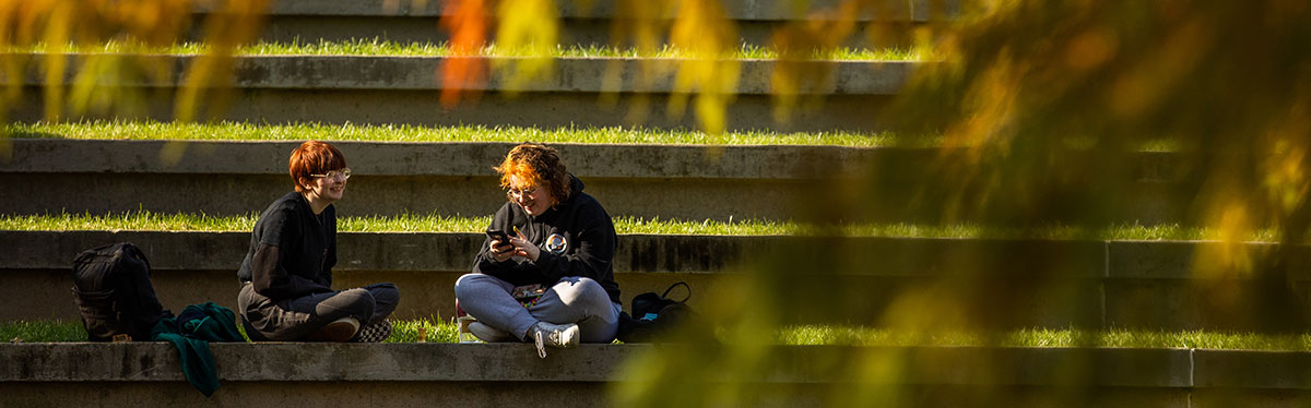A student sitting and studying in the HSS amphitheater.