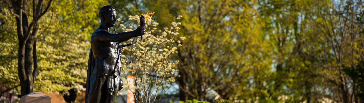 Spring flowers bloom around the Torchbearer in Circle Park on the evening of April 02, 2020.