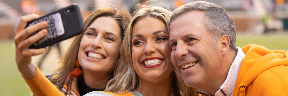 A cheerleader poses for a selfie with family during the game between the Vanderbilt Commodores and the Tennessee Volunteers in Neyland Stadium on November 30, 2019.