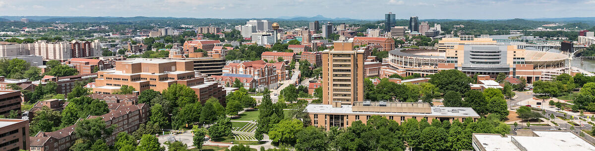 Aerial photograph of the University of Tennessee with McClung Tower, Hodges Library, Haslam Business building and Neyland Stadium as the prominent buildings taken from Tennessee National Guard helicopter on June 29, 2022.