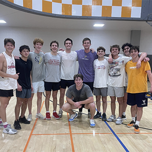 Members of Sigma Nu after an intramural basketball game. They are inside of the basketball court at the T Rec.