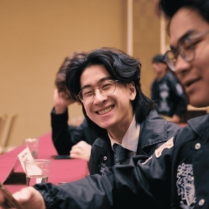 Member of Lambda Phi Epsilon smiling for a photo