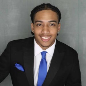 Man in Black suit with blue tie