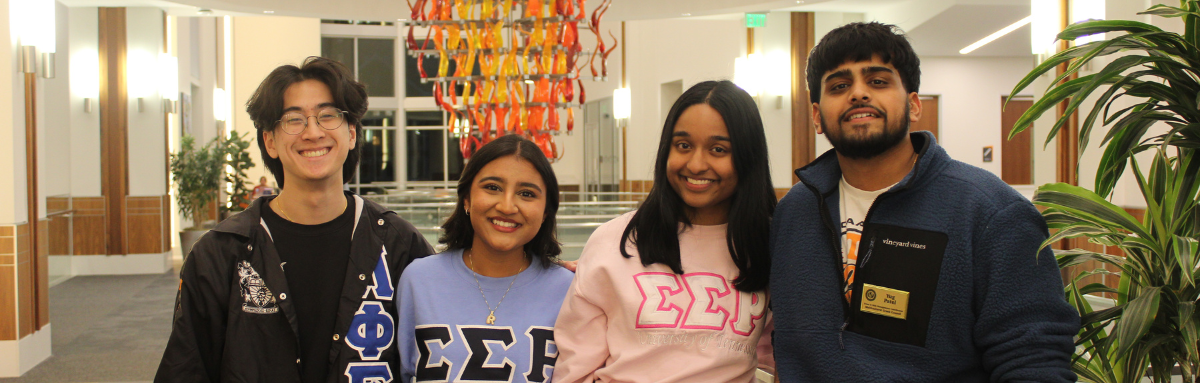 Four MGC students stand in Student Union