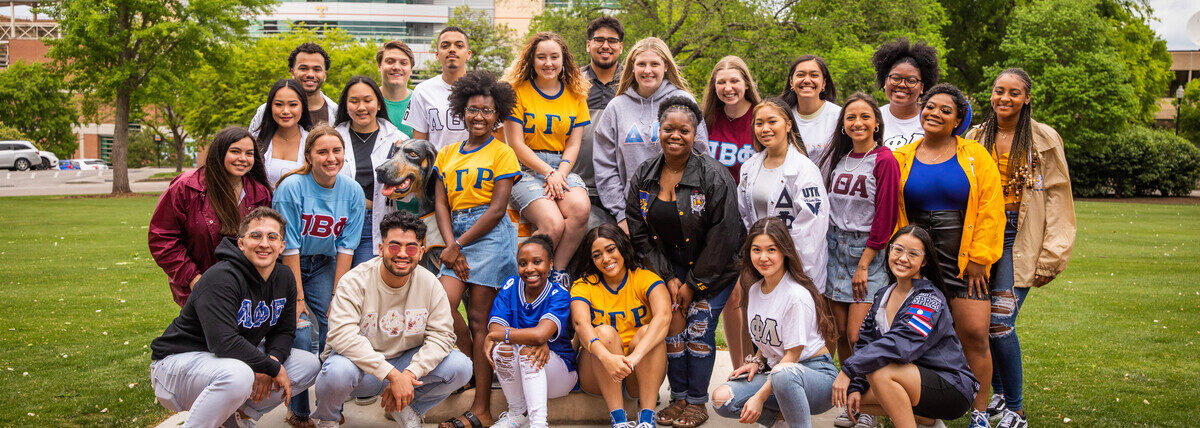 Students pose for a group photo with the Smokey statue at Circle Park during a lifestyle photo shoot for the Office of Sorority and Fraternity Life on April 29, 2021. Photo by Steven Bridges/University of Tennessee