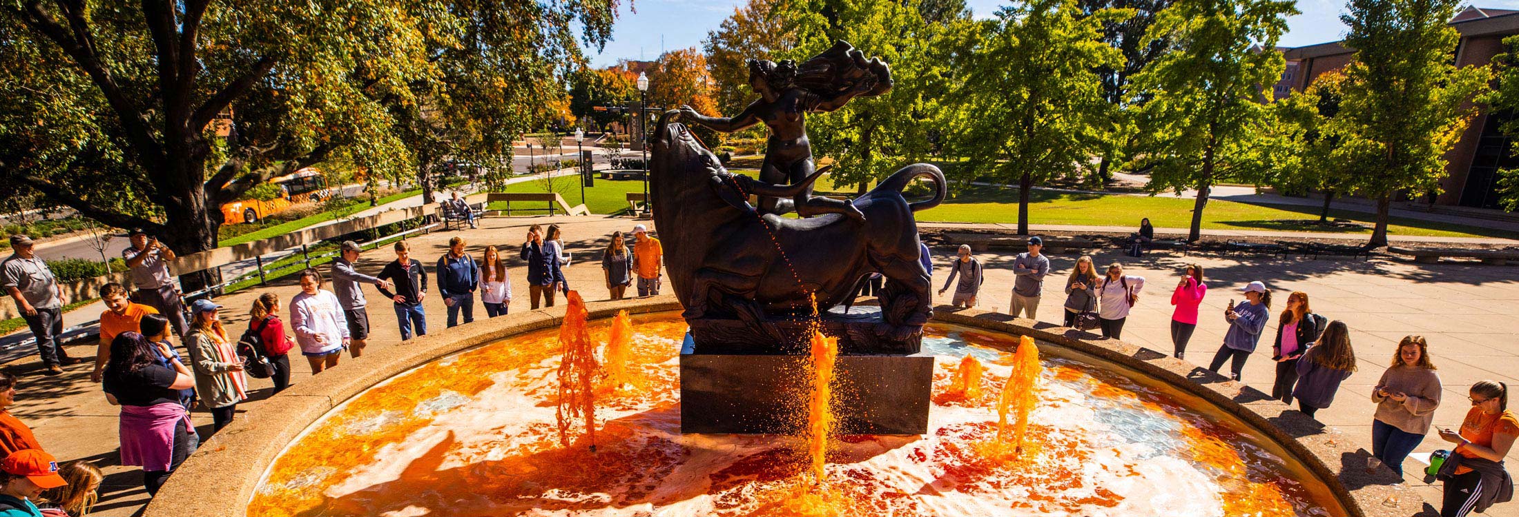 Students dyeing of the Europa and the Bull Fountain orange