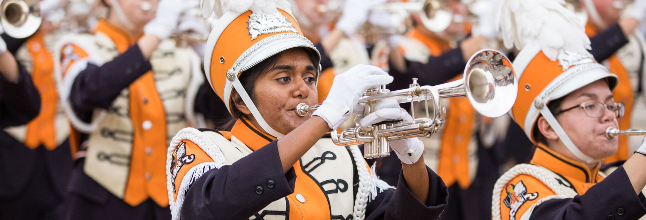 Student playing trumpet in the Pride of the Southland Marching Band