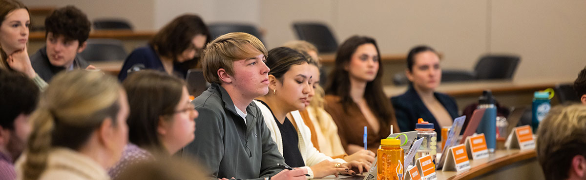A grop of students focus intently during a class.
