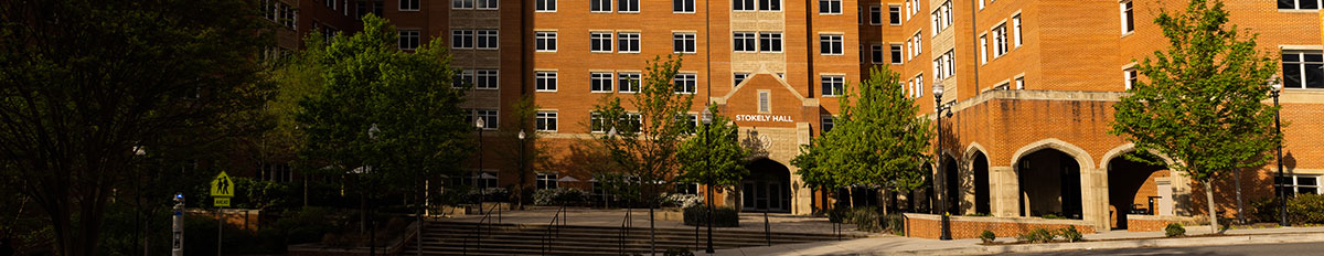 An exterior of the front side of Stokely Hall on a sunny day