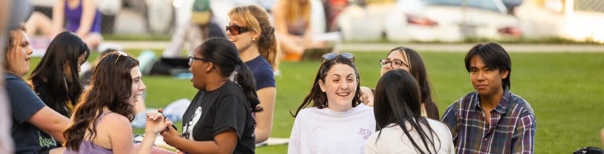 Students hangout while enjoying a warm afternoon in the Magnolia Hall Courtyard