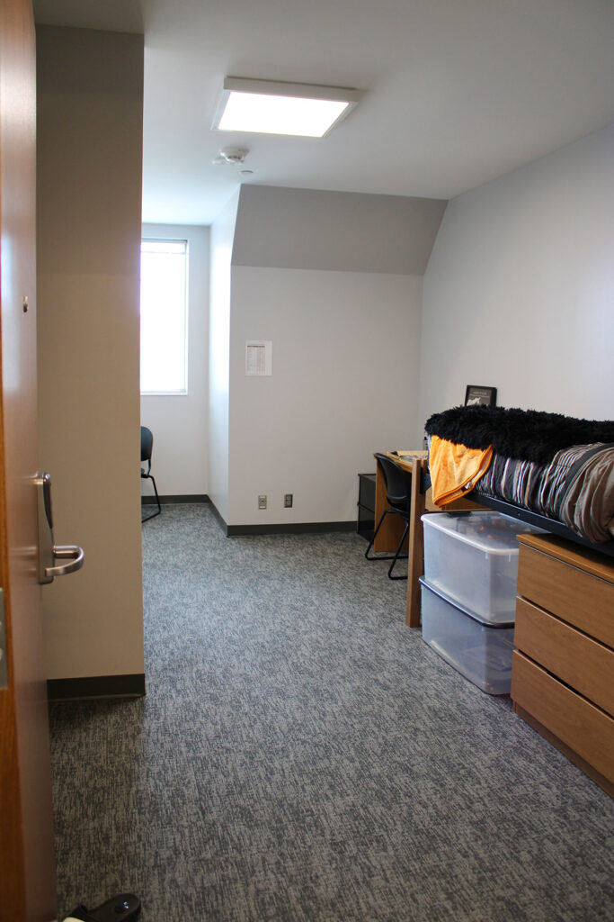 A semi furnished bedroom in Magnolia Hall.