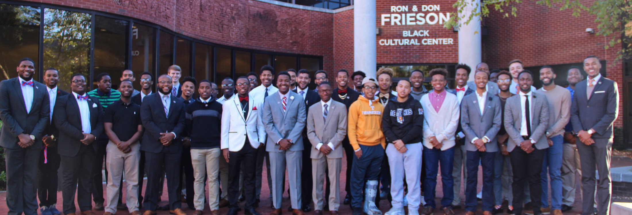 Students of BUE posed outside Frieson Black Cultural Center
