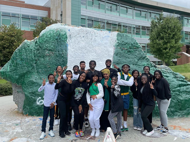 Group of ASA students posing in front of the Rock