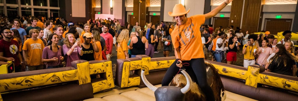 A student rides a mechanical bull during Vol Night Long.