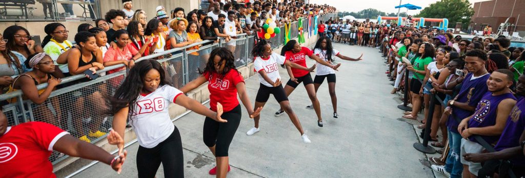 Students dance in a step show during Caribbean Splash Jam.