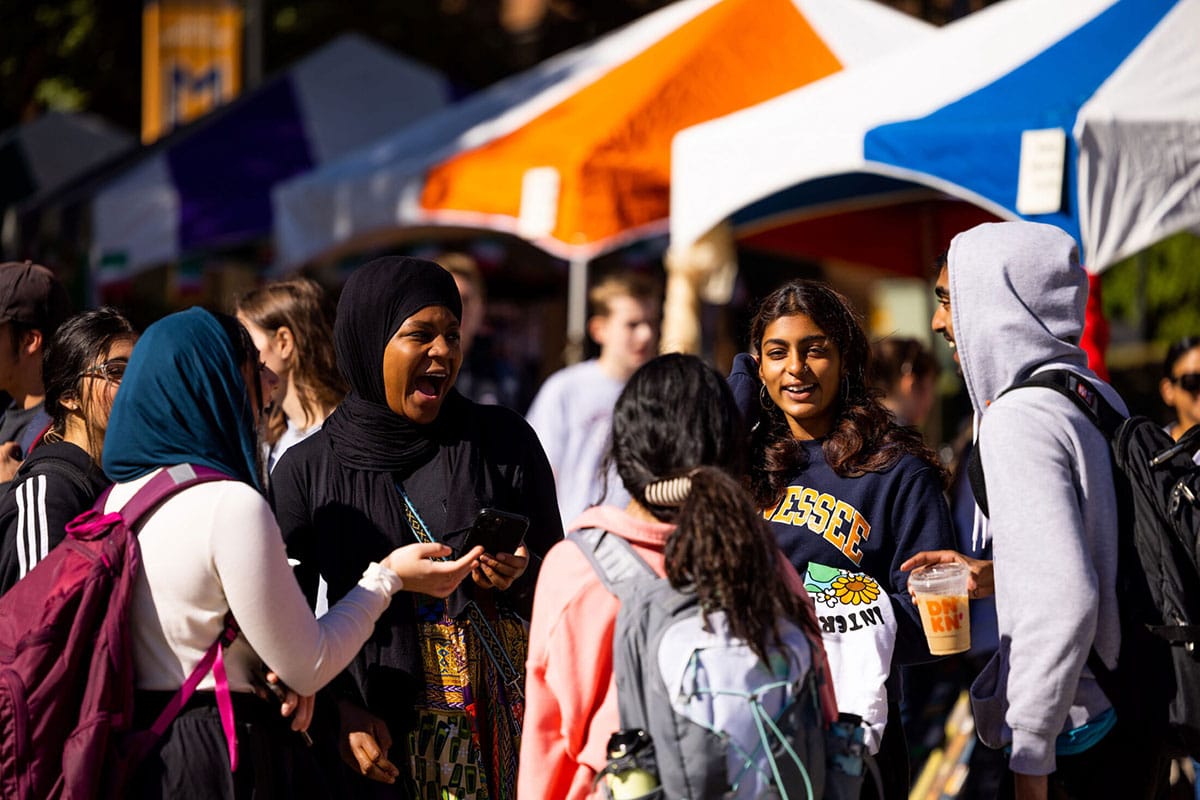 Students visit during the International Festival hosted by the International House Center for Global Engagement along Ped walkway.