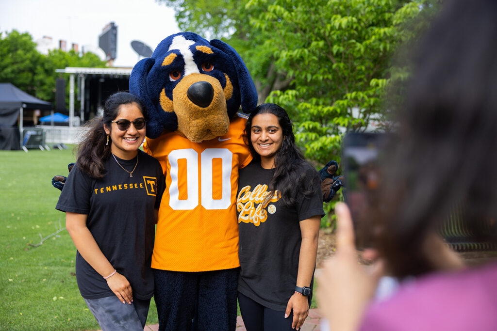 Smokey poses for a group photo with students during the 20th Anniversary of Volapalooza in Circle Park.