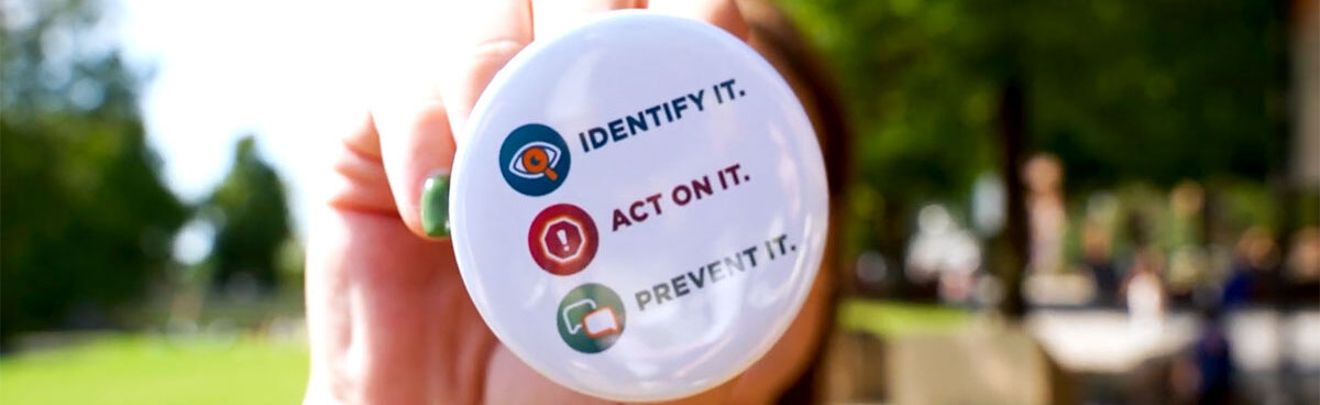 Hazing prevention button that reads, Identify It, Act on It, Prevent It.