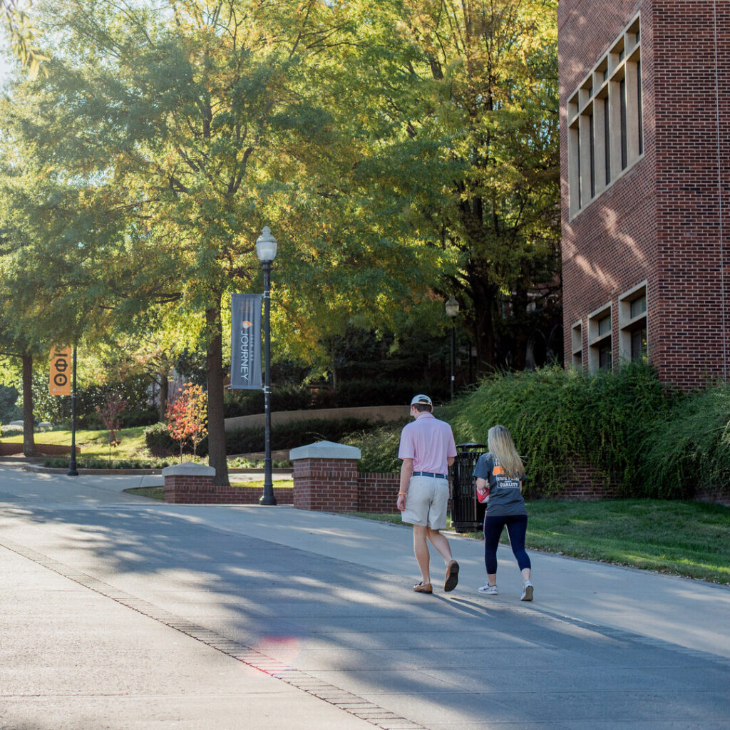 Students walking along Pedestrian Walkway on UT campus. Photo by Joseph Spencer.