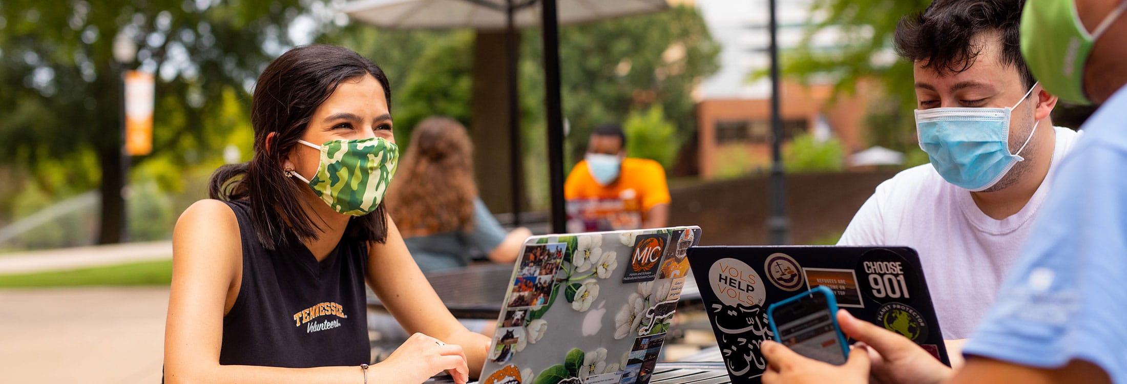 Students wearing masks and social distancing