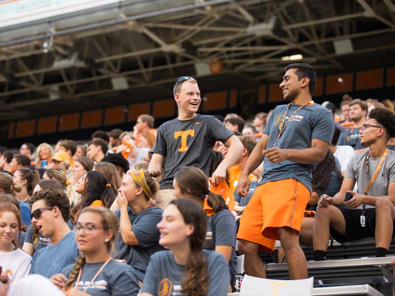 Students dance in the stands of Neyland Stadium