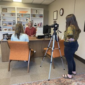 Two students interview Chancellor Donde Plowman in her office