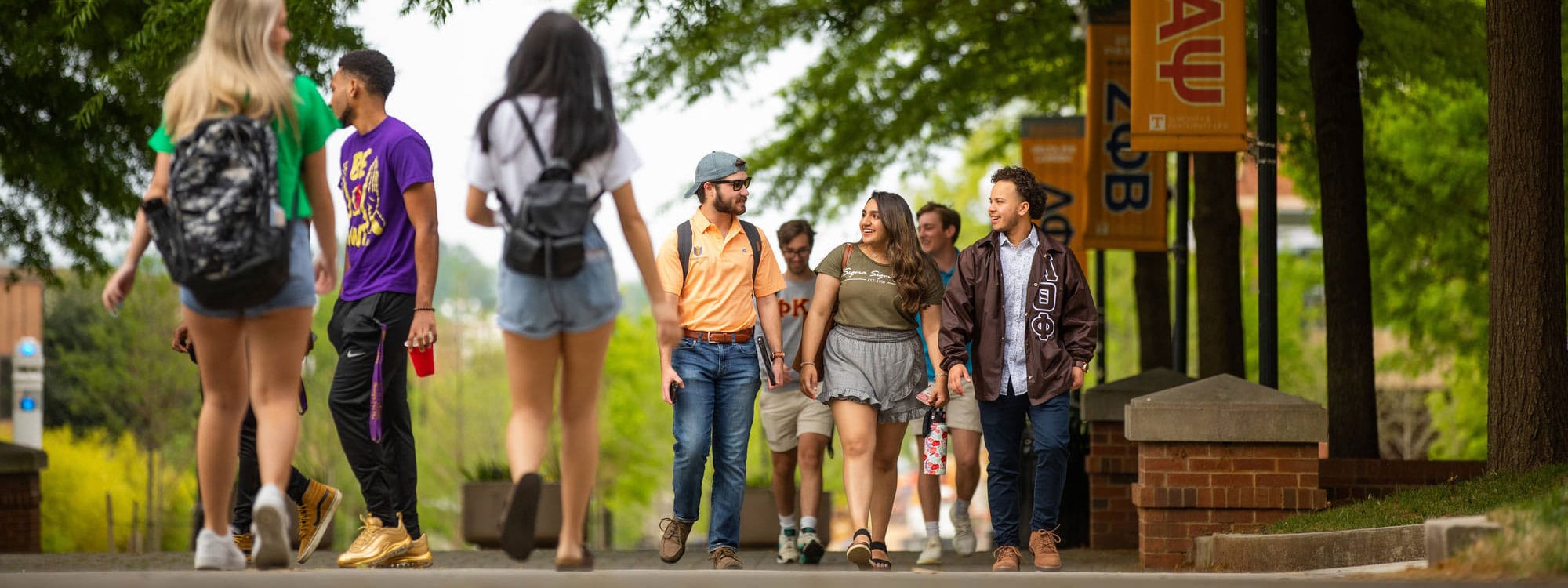 Students walk along Ped walkway