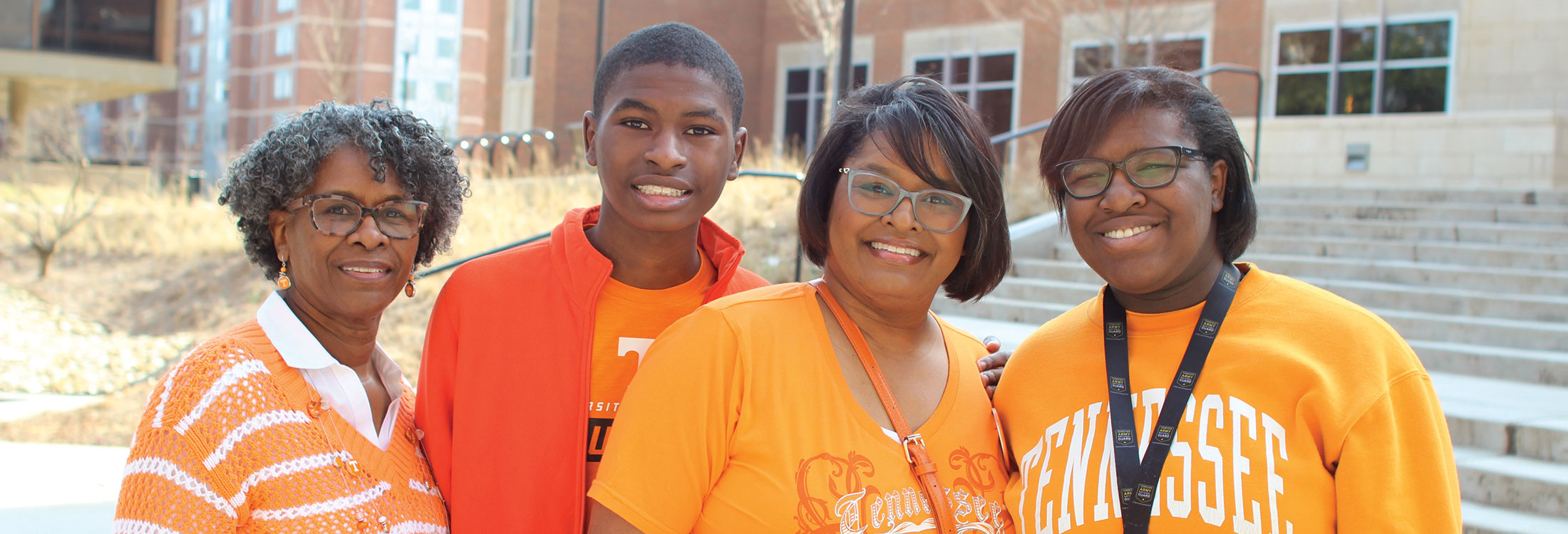 A student and their family pose for a photo at Spring Family Reunion