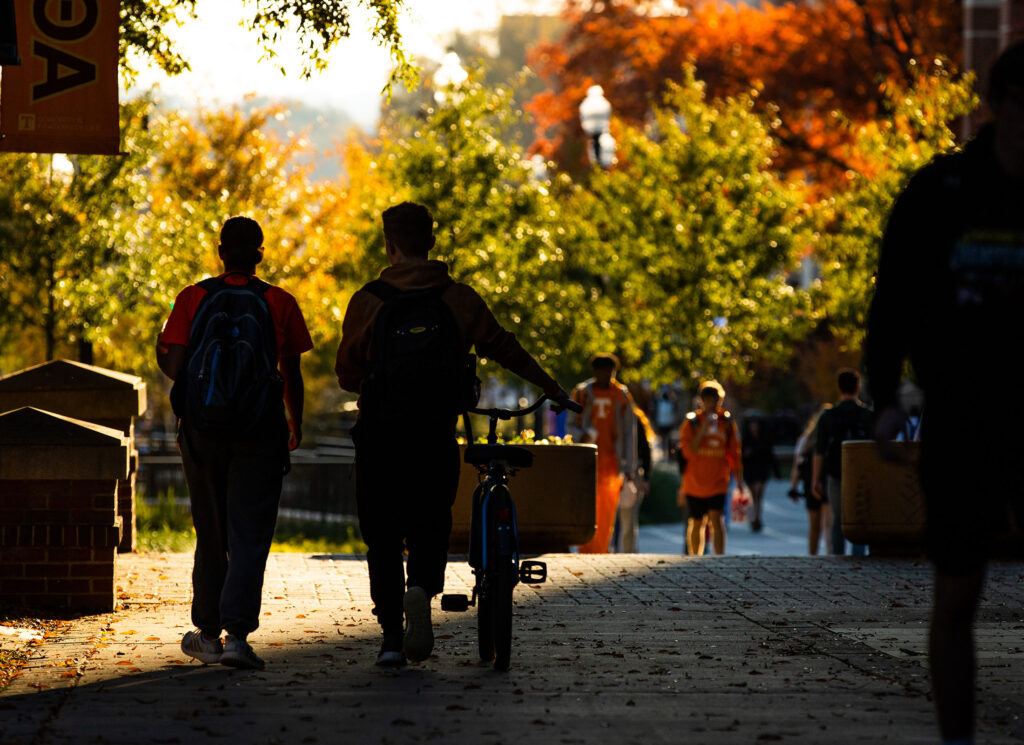 Graduate students walk across campus