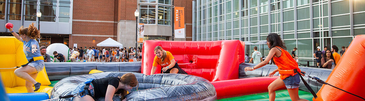 Students playing on inflatable yard games