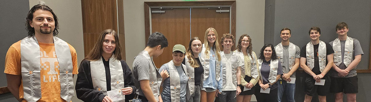 Student Union student employees standing in a line in the Student Union ballroom.
