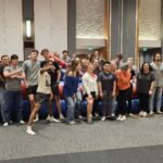 Picture of a group of students at the Student Union at event with bounce houses and blow up objects.