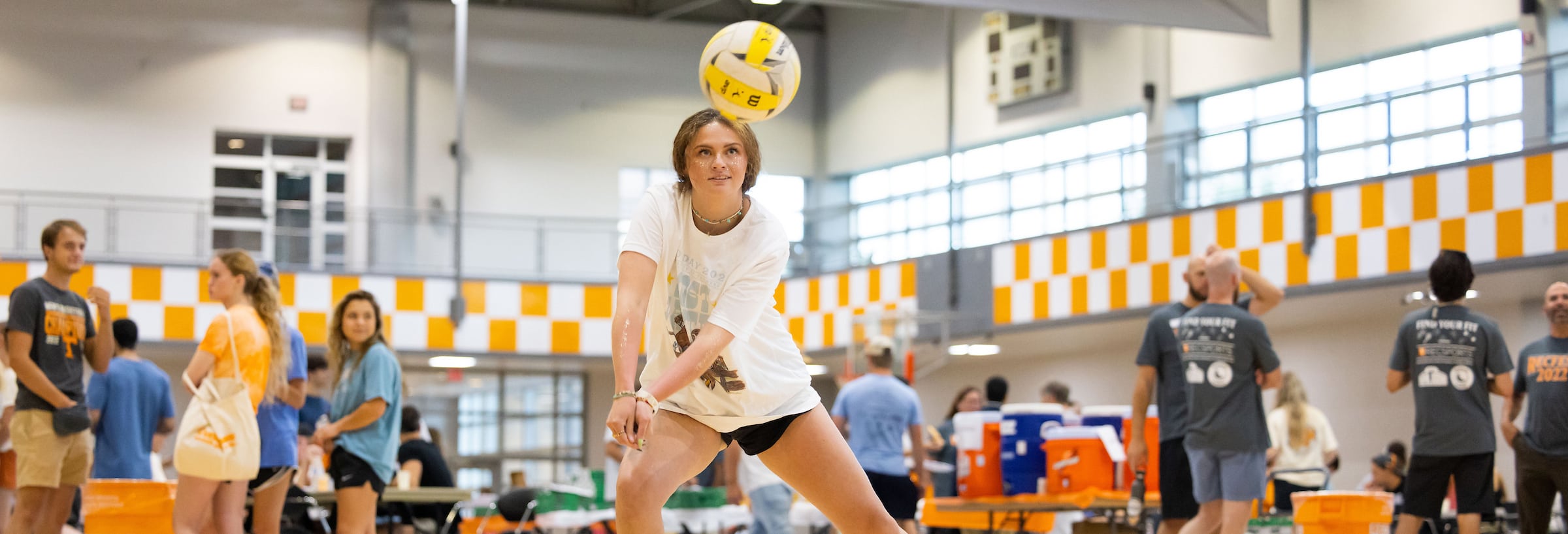 student in the TRECS hitting a volleyball